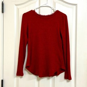 I’m selling a red long sleeve with lease at the top.